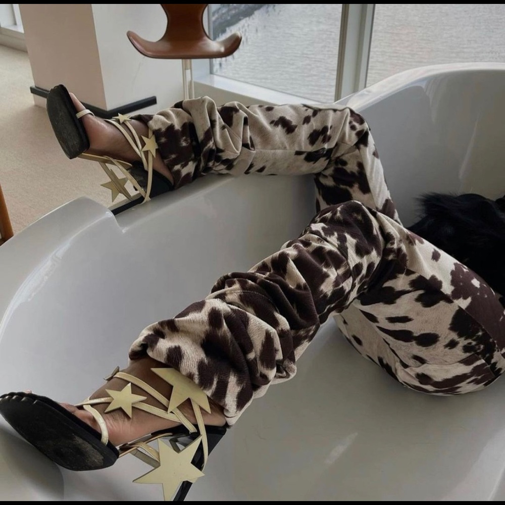 Nyrva unisex brown cow print pant.  Size 28.